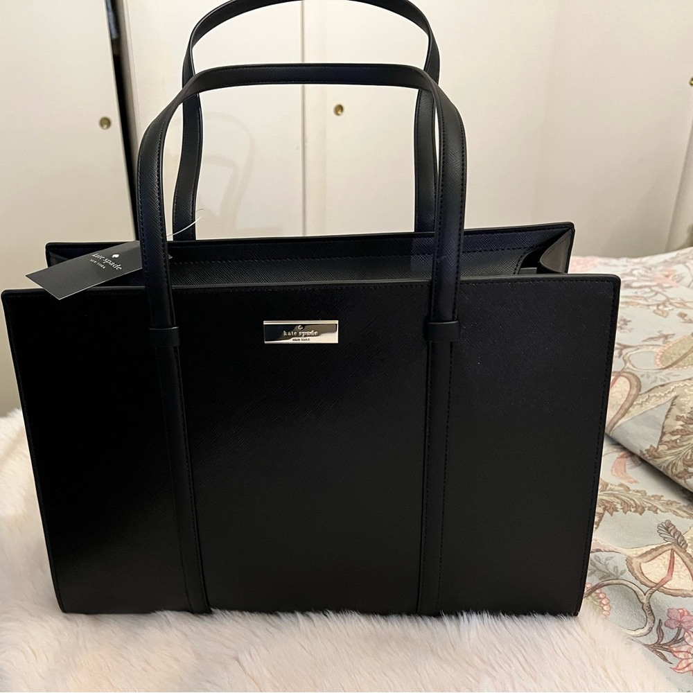 Kate Spade Kenzie Large Tote

Length: 4.6"
Height: 10.4"
Width: 14.6"